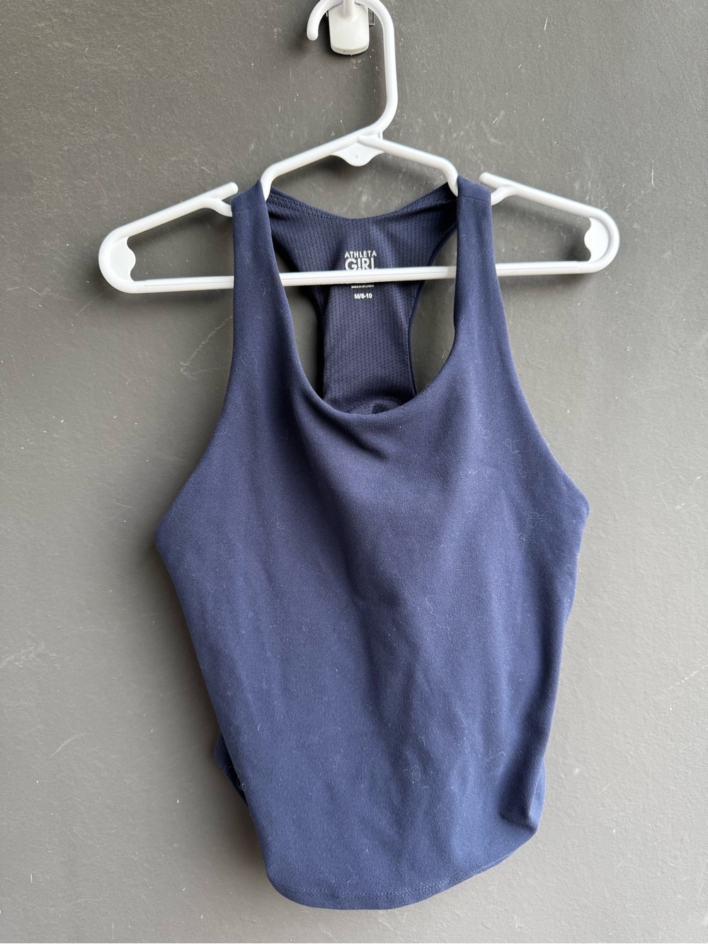 navy blue Athleta Girl high-neck racerback sports bra